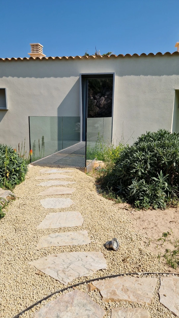 Custom-built terrace integrated into the surrounding landscape of this Bonaire villa.